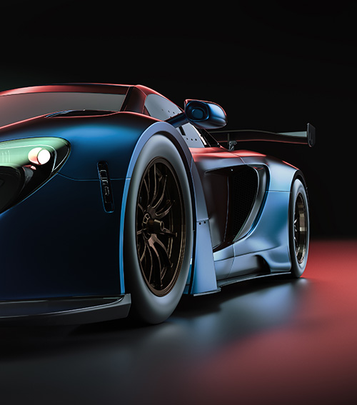 Close-up of a sleek blue race car with aerodynamic design and large rear spoiler on a reflective surface.