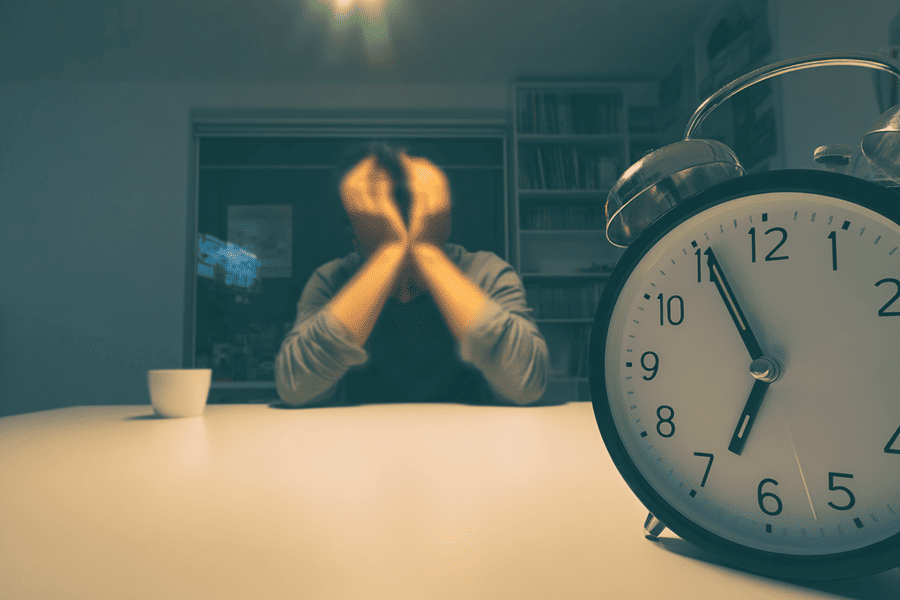 man stressed and running out of time