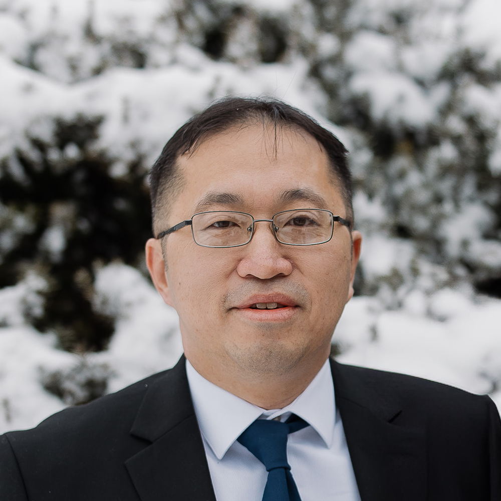 Pastor Mike Cheng headshot in front of North Shore Baptist Church in Bayside, NY