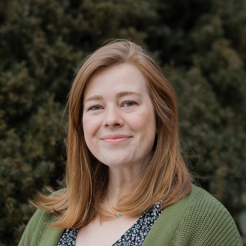Staff member Geneva Morse headshot in front of North Shore Baptist Church in Bayside, NY