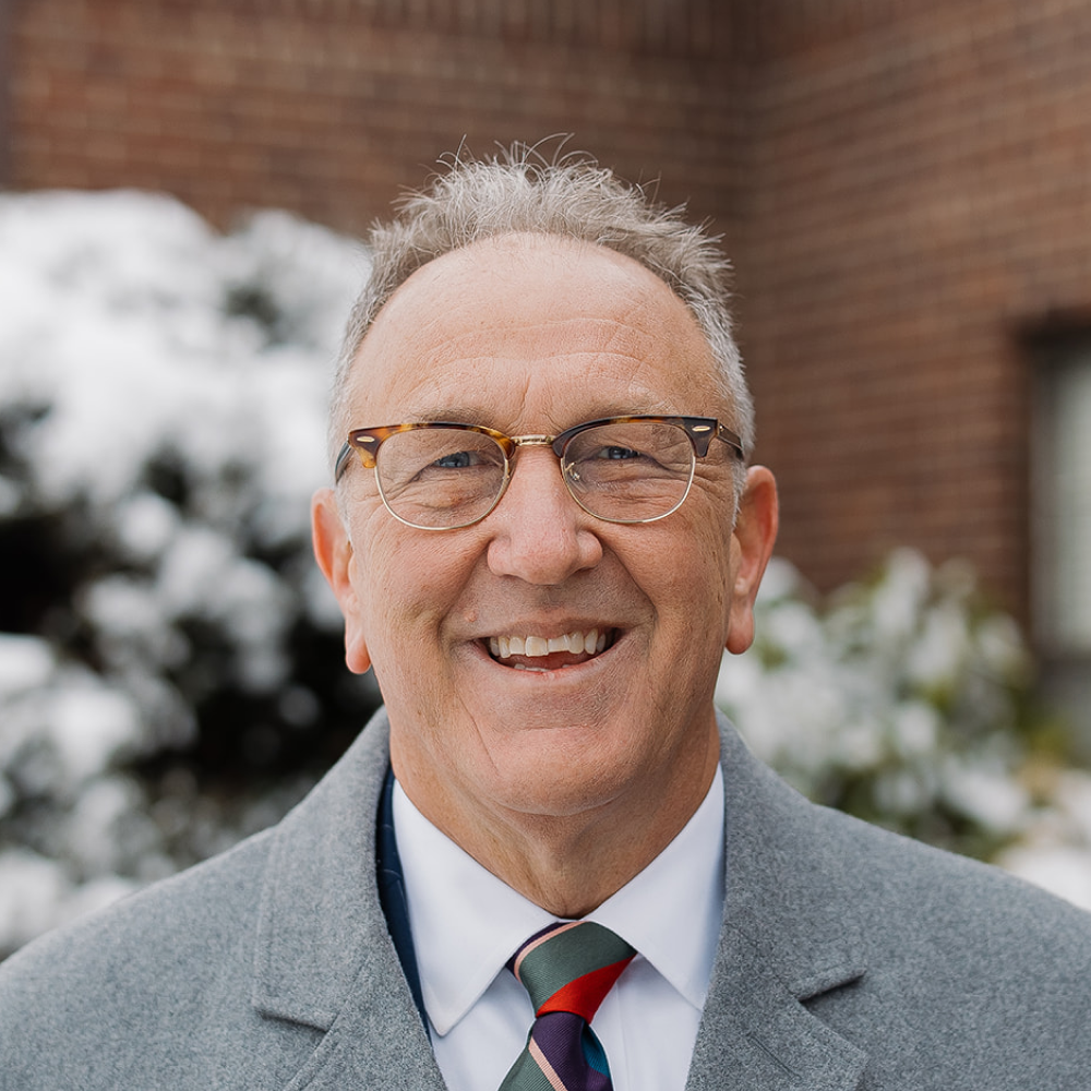 Pastor Ed Moore headshot in front of North Shore Baptist Church in Bayside, NY