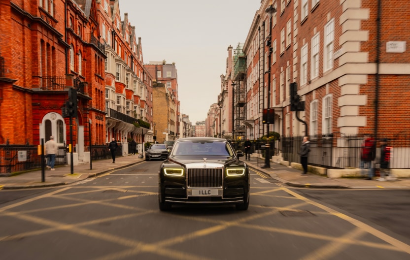 Corporate chauffeur driving executive through central London in a premium vehicle