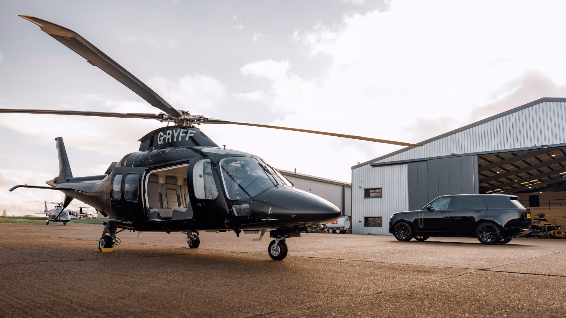 Private helicopter waiting on the tarmac for luxury helicopter transfers in London