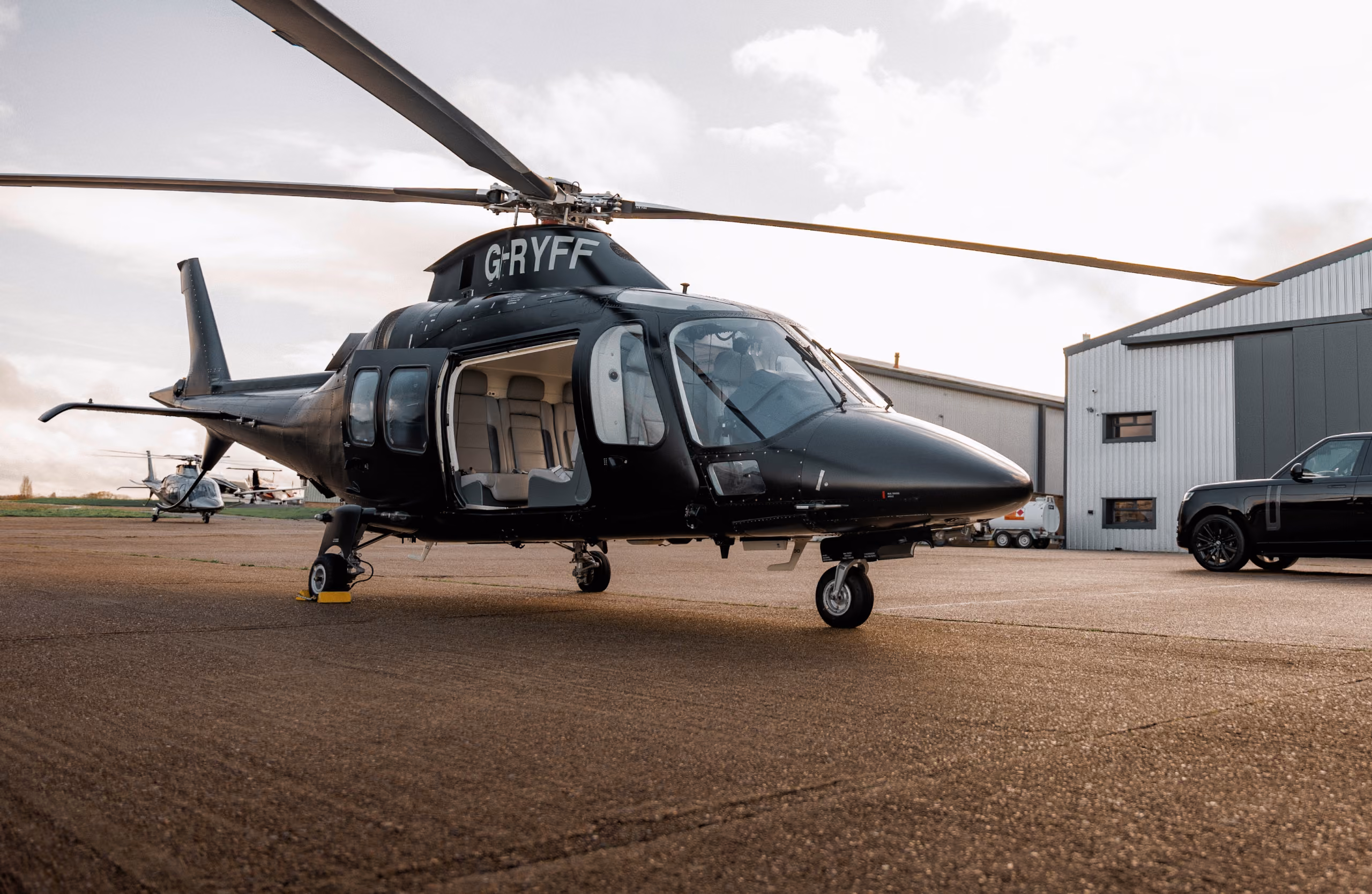 Private helicopter waiting on the tarmac for luxury helicopter transfers in London