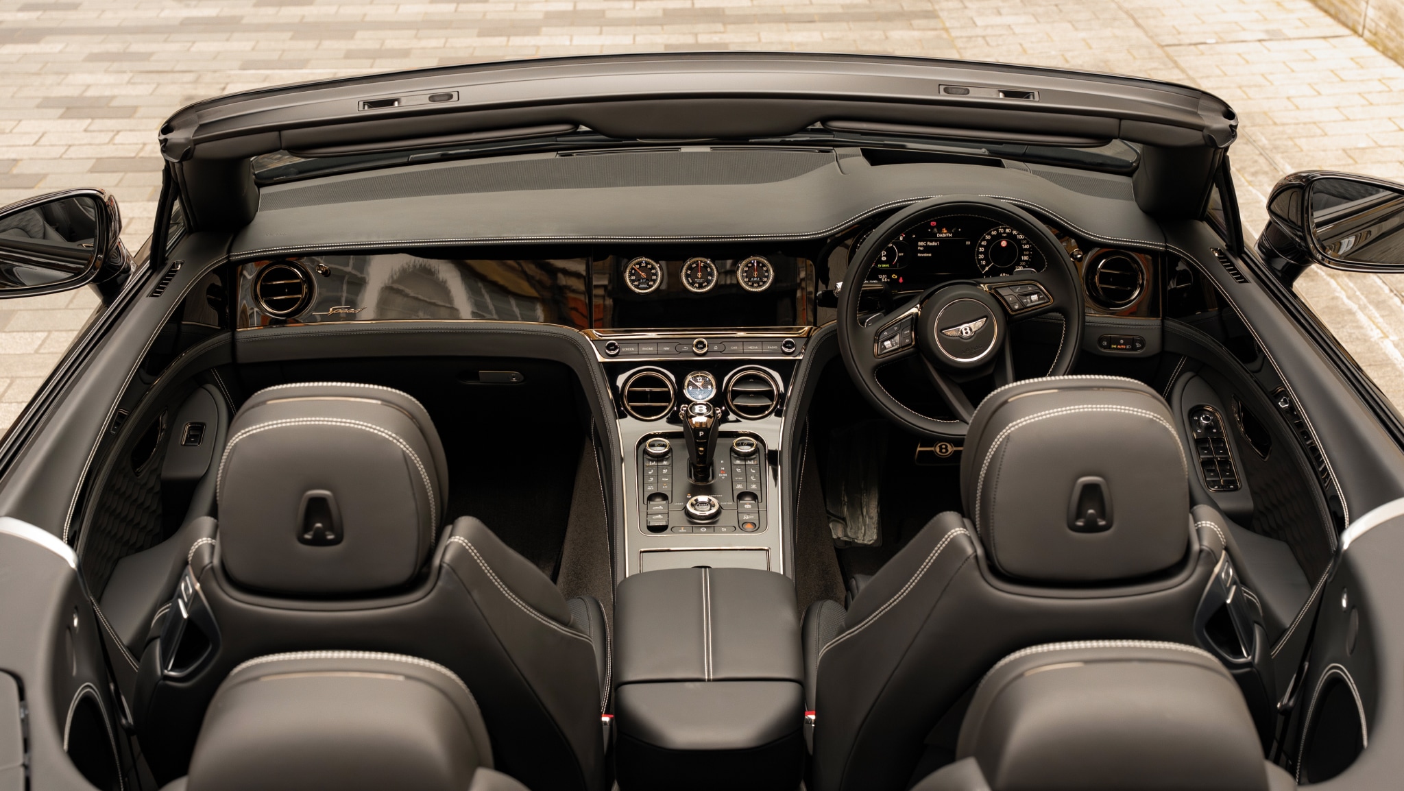 Luxurious interior of a Bentley Continental GTC convertible offered by LLC Cars for exclusive chauffeur travel