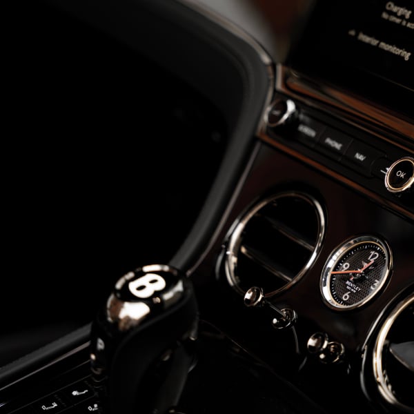 Interior shot of Bentley Continental GTC featuring premium leather and wood trims