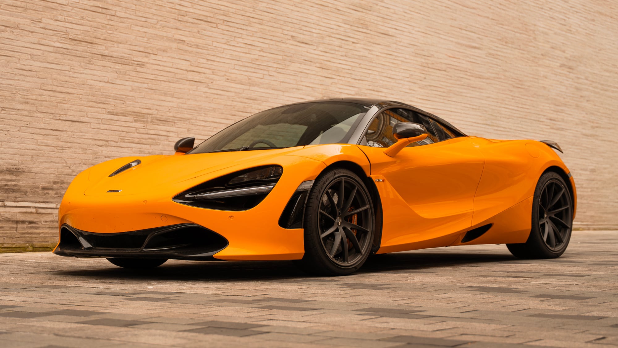 McLaren 720S with iconic dihedral doors open for a dramatic entrance