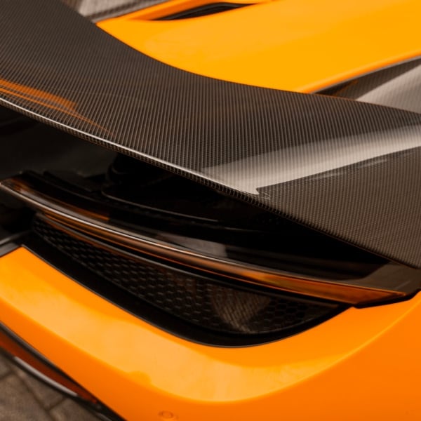 Rear view of McLaren 720S highlighting its aerodynamic shape and LED taillights