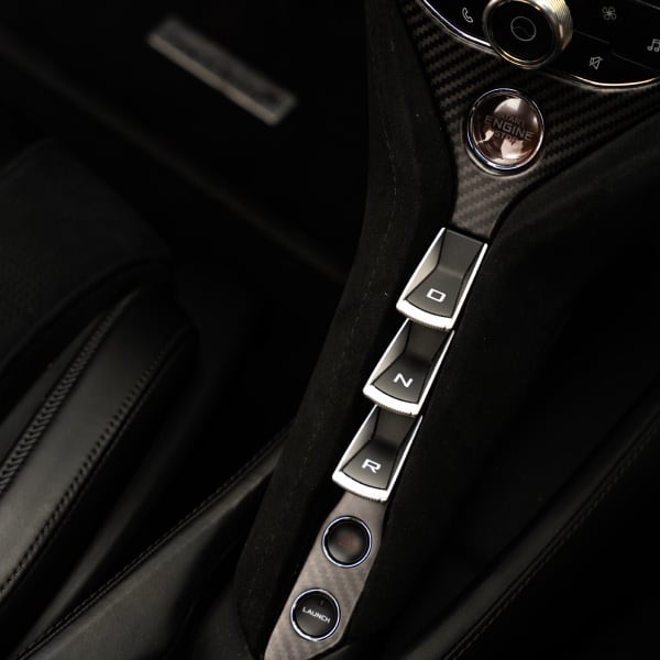 Close-up of McLaren 720S twin-turbo V8 engine showcasing raw power