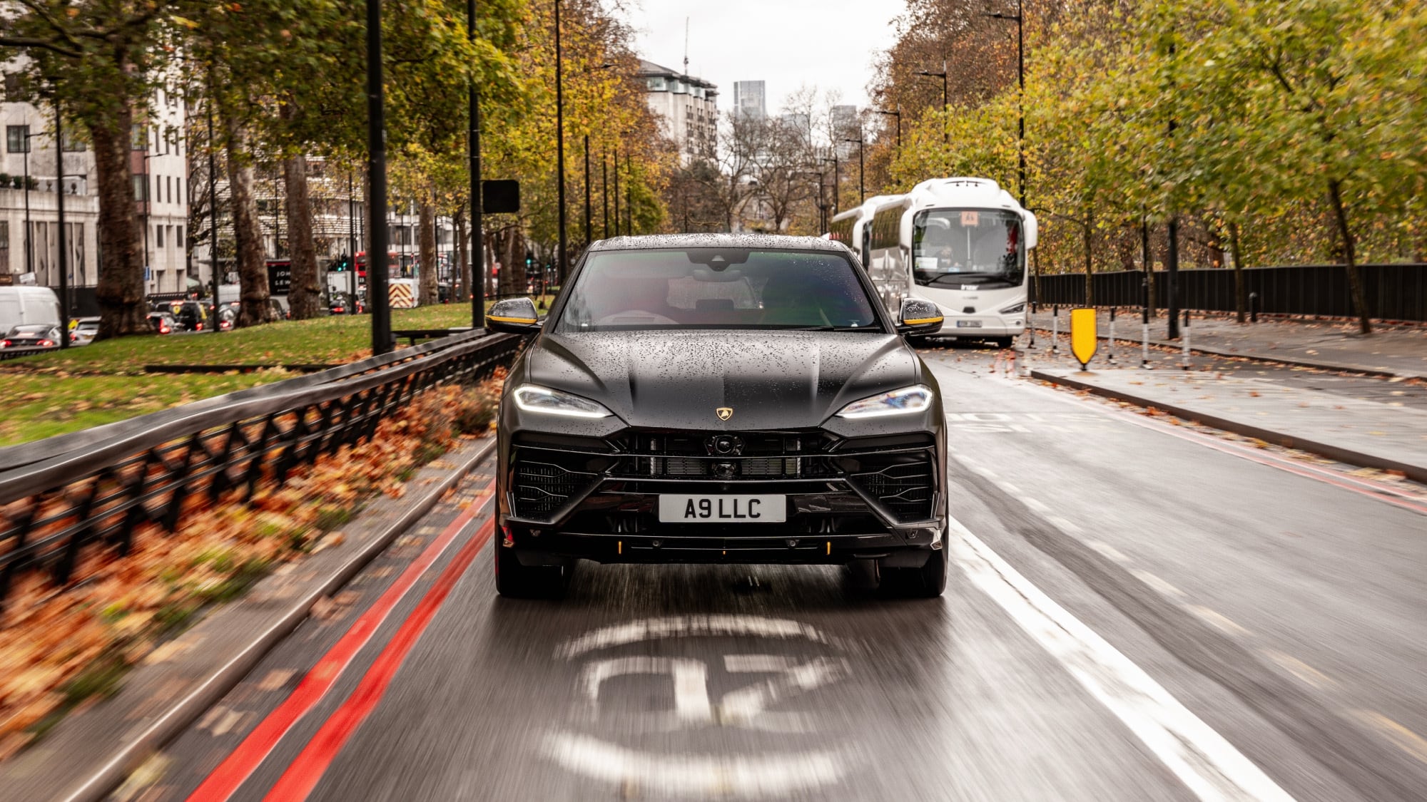 A dynamic action shot of the Lamborghini Urus driving through a central London.