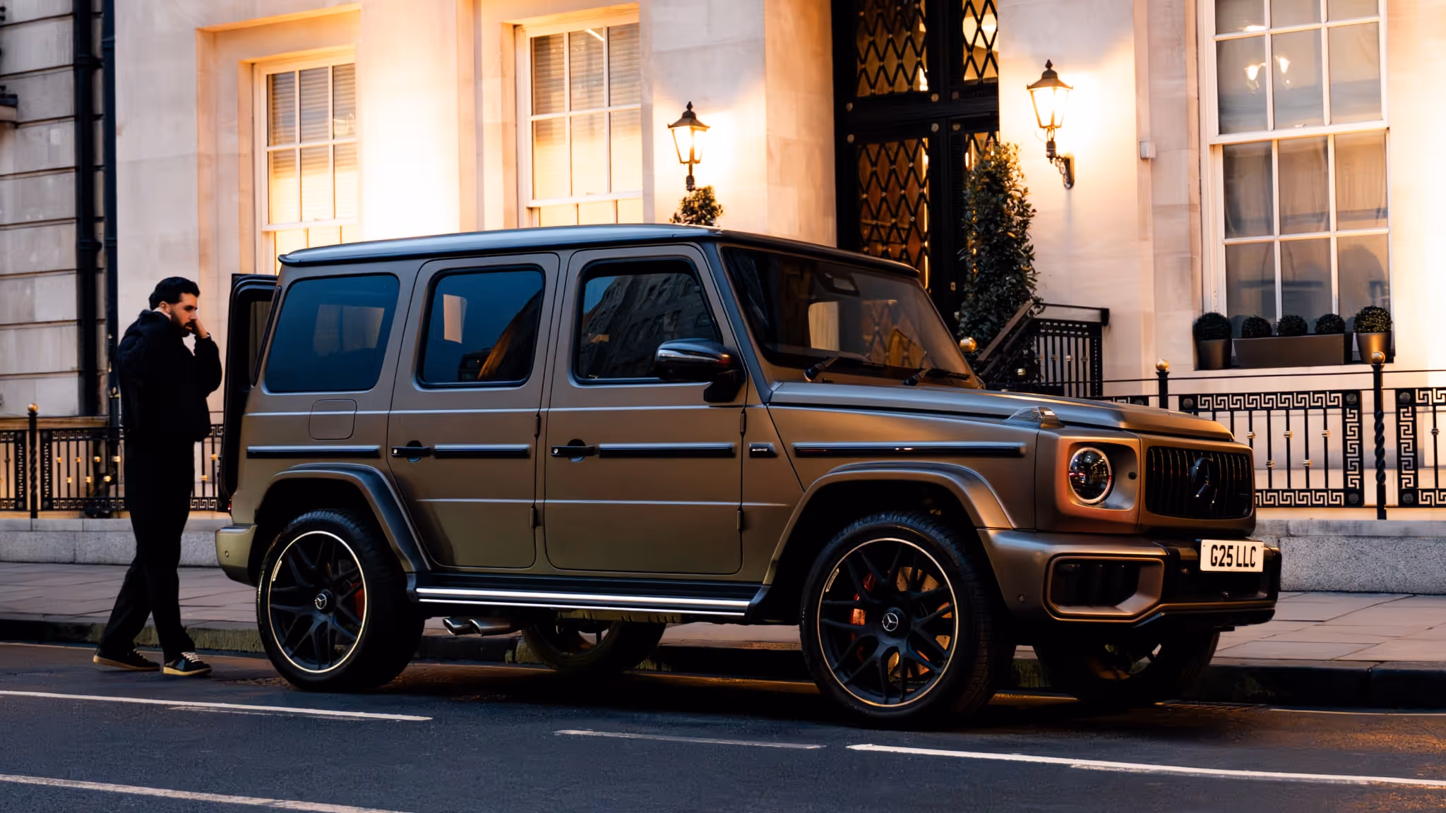 Luxury Mercedes G-Wagon parked outside an exclusive residence, providing private chauffeur transfers, hotel pickups, and seamless self-drive transport.