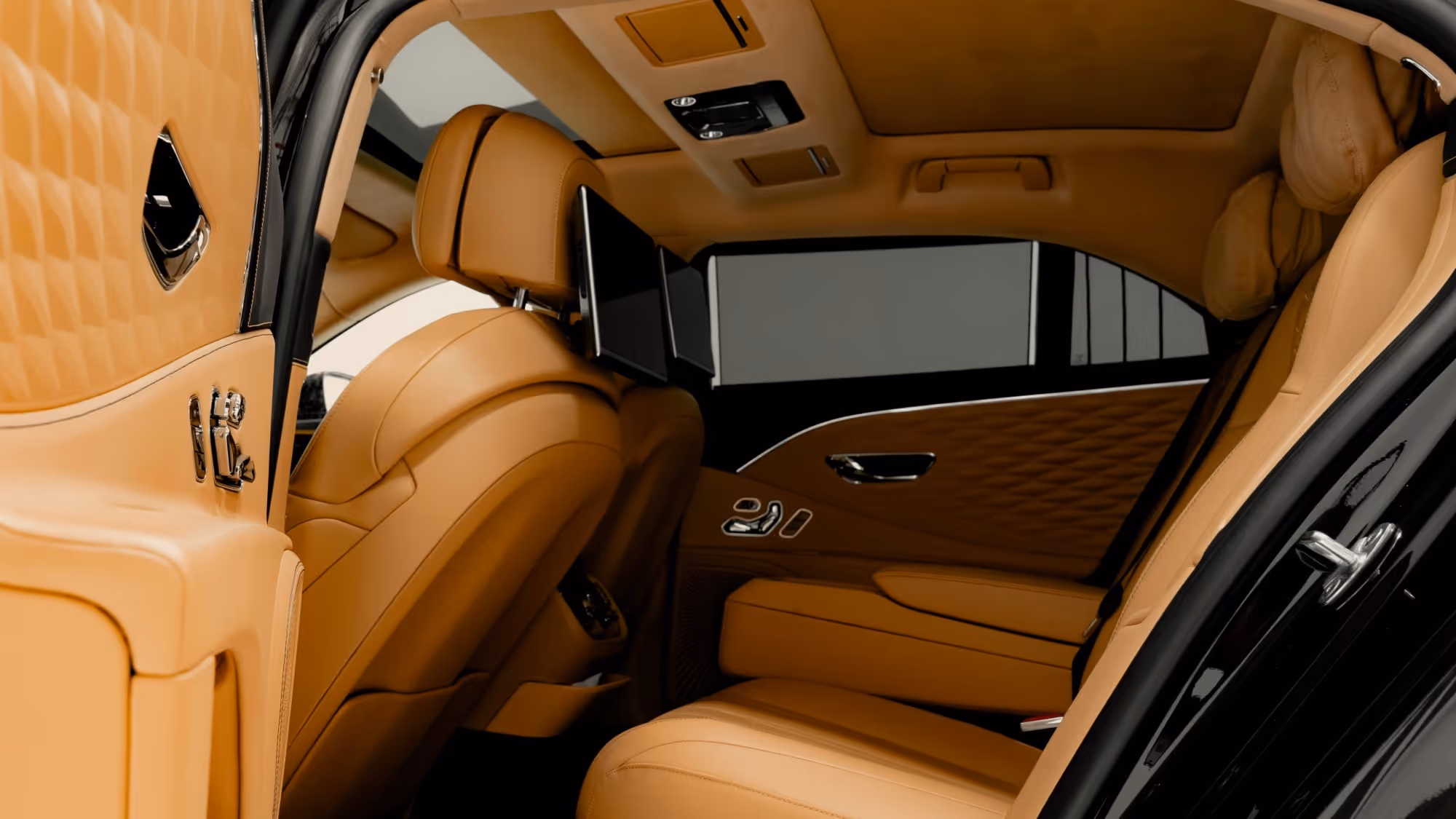 Bentley Flying Spur in London with chauffeur service near a modern city building