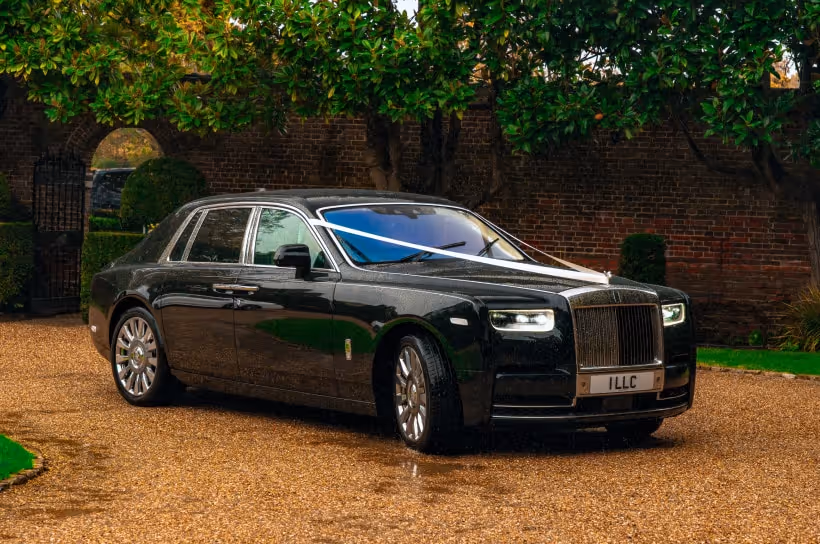Rolls-Royce Phantom chauffeur-driven through central London streets — LLC luxury wedding chauffeur hire