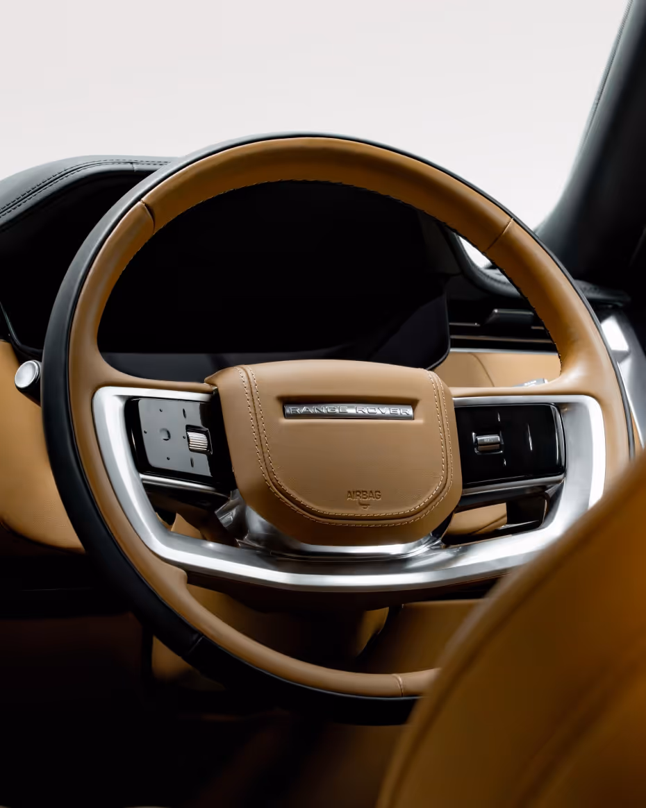 Close-up of the Range Rover Autobiography cabin, highlighting premium leather finishes, elegant detailing, and the sophisticated interior environment.
