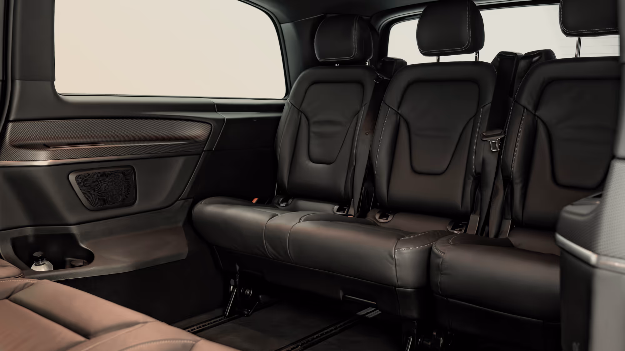 Interior of the Mercedes-Benz V-Class, showcasing spacious leather seating, generous passenger room, and a comfortable cabin designed for luxury chauffeur travel and group transfers.