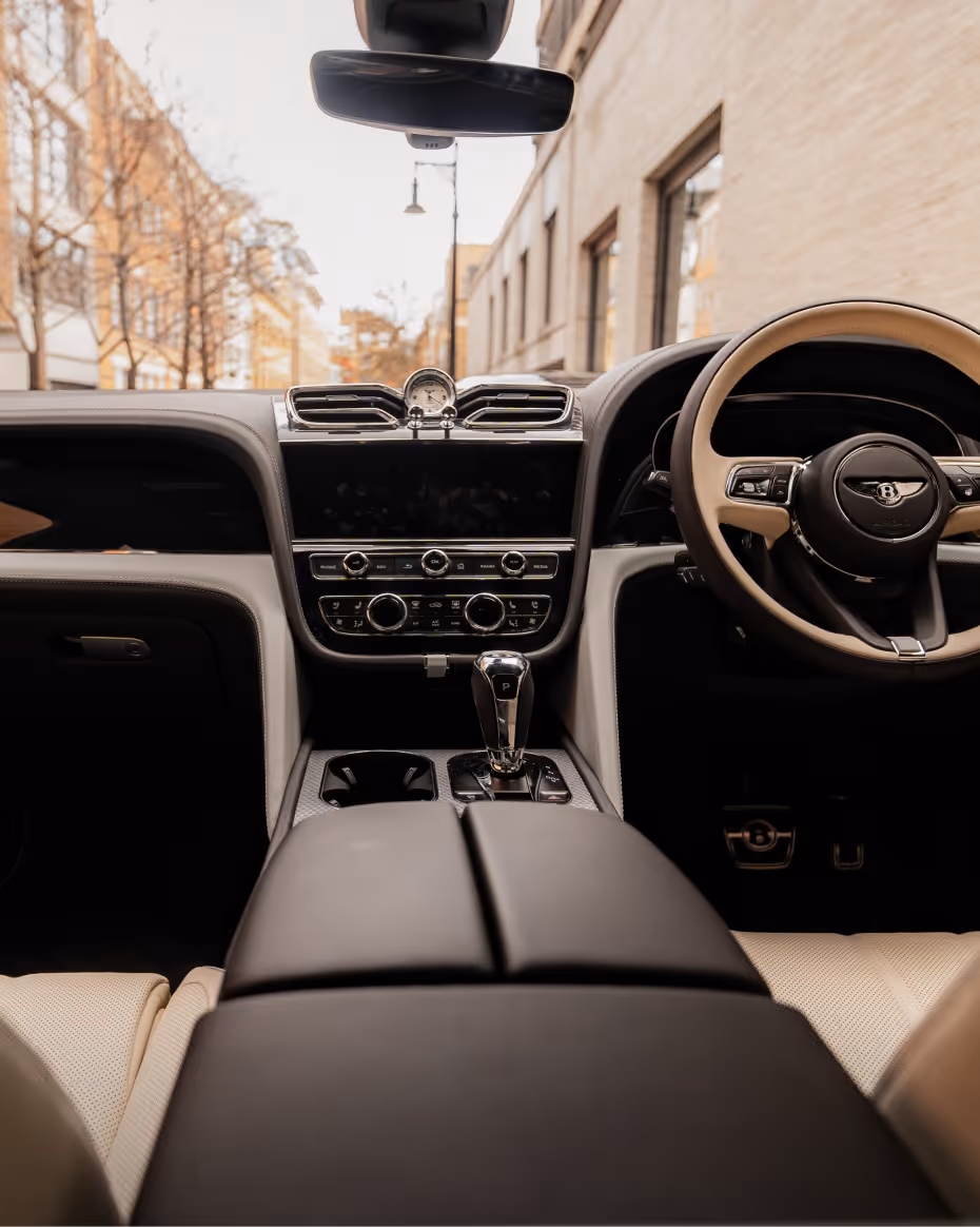 Bentley Bentayga interior with premium materials and chauffeur-driven comfort.