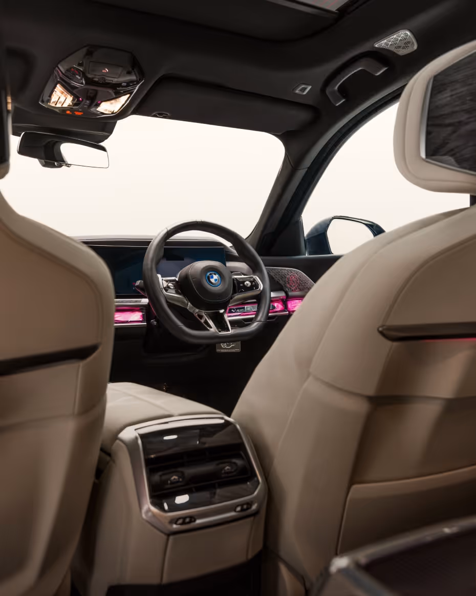 Interior view of the BMW 7 Series, showcasing spacious rear seating, premium materials, ambient lighting, and executive comfort designed for luxury chauffeur travel.
