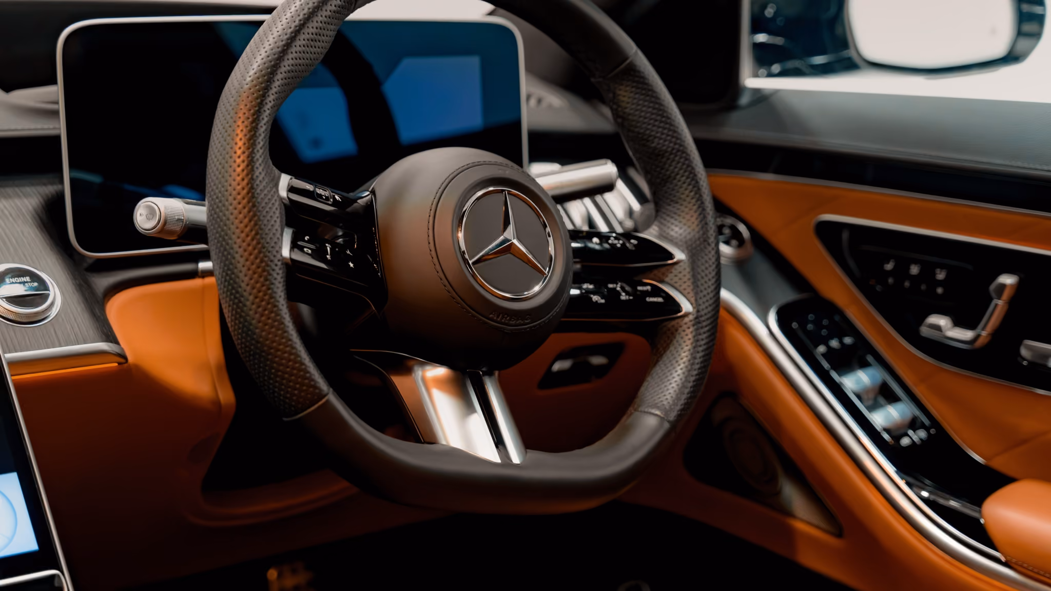 Close-up of the Mercedes-Benz S-Class interior, showcasing premium leather upholstery, advanced digital displays, and elegant craftsmanship designed for first-class chauffeur travel and executive comfort.