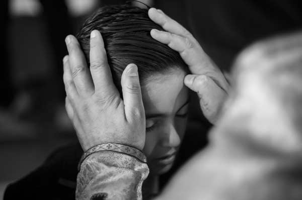 Father Jacques Mourad blesses a young boy in Cappadocia, Turkey.