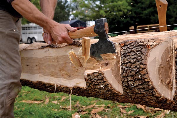 I am hewing the ridge beam for a log cabin