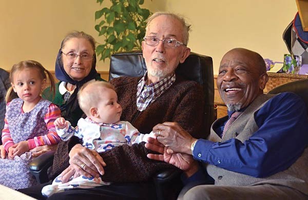 Relaxing with his wife, Verena, and John Perkins.