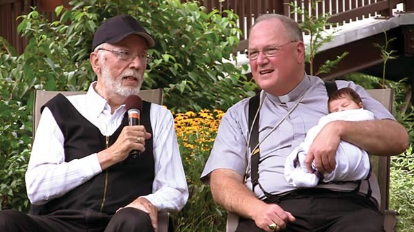 Arnold with Cardinal Dolan in 2015.