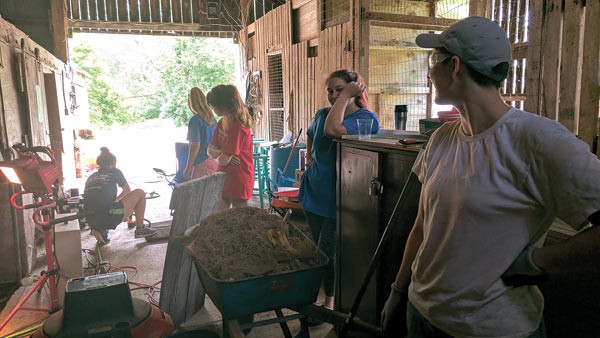 Empower Youth interns and volunteers renovate the Barn Studio, 2017.