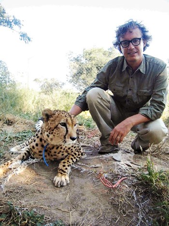 The author with a cheetah at his farm