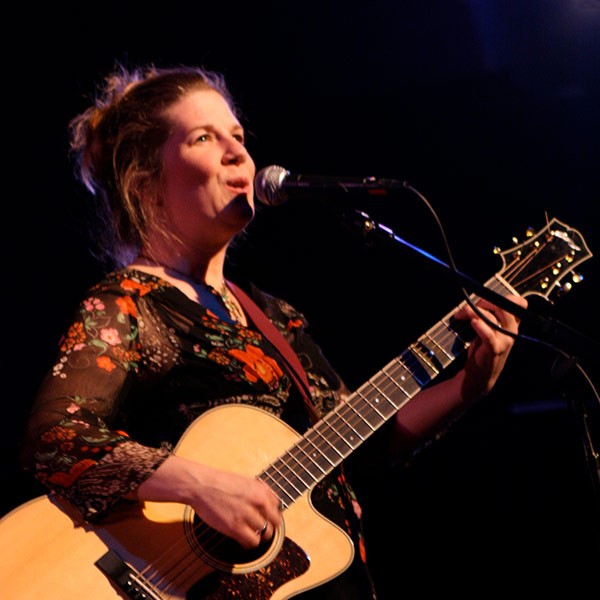 Dar Williams singing on a stage