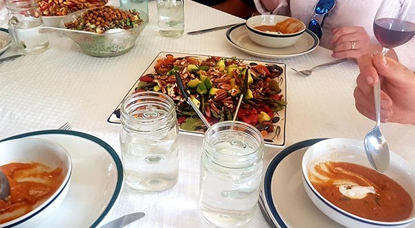 people eating soup and salad