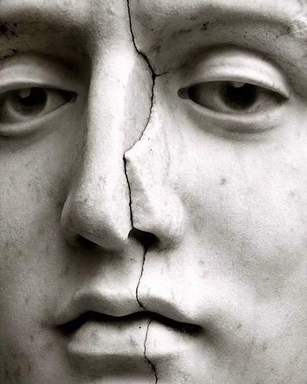 cracked face of a marble statue