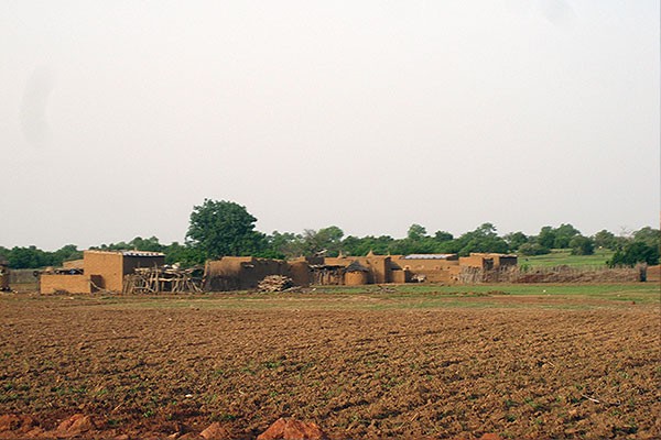 field and village in Burkina Faso