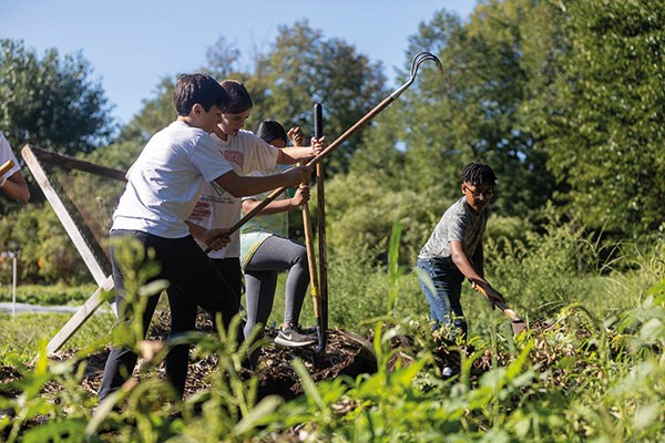 Earthworks Youth Program students learn about different types of soil.