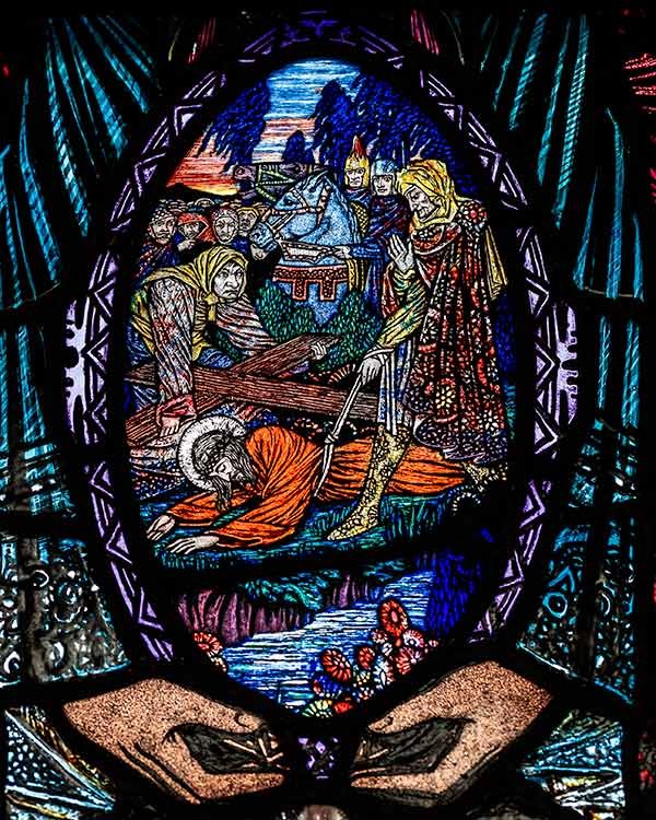 stained glass depicting Jesus falling for the third time