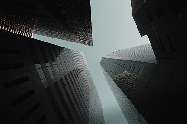 looking up at skyscrapers