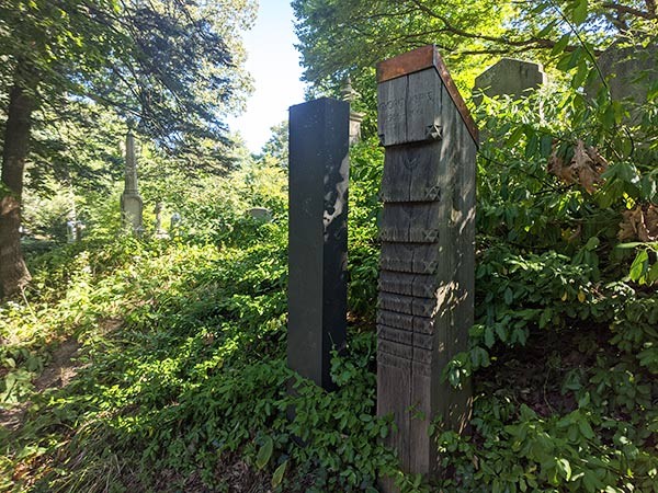 wooden headstones in a cemetery