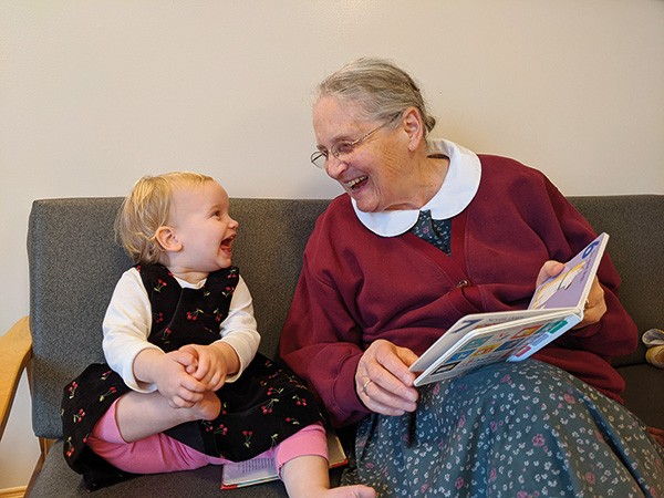 Fida with grandchild
