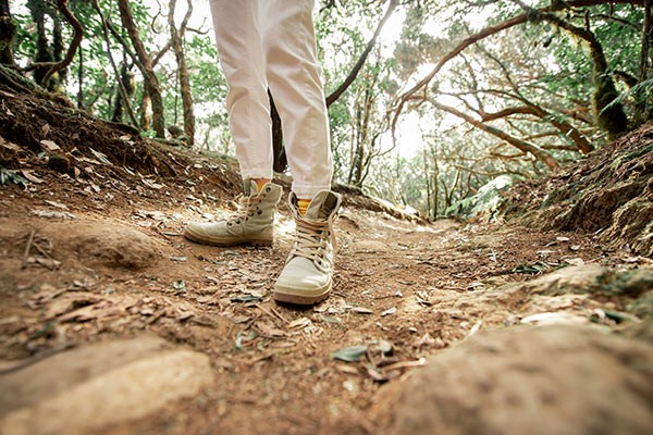 a woman hiking on a trail