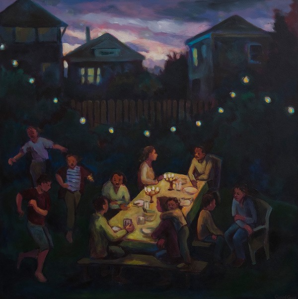 friends and family having supper in a backyard
