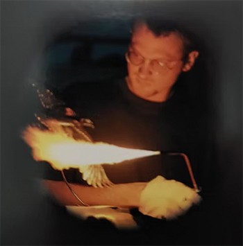 a sculpture artist welding