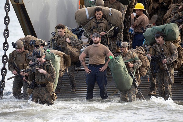 U.S. Marines disembark from a U.S. Navy Landing Craft Utility