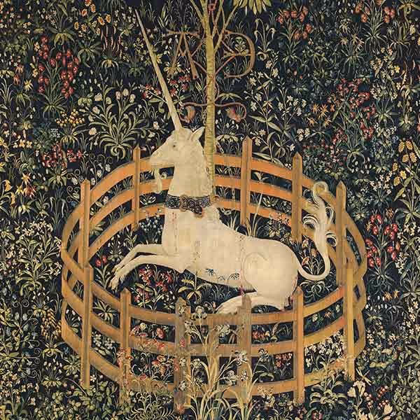 Medieval tapestry showing a white unicorn lying inside a wooden fence surrounded by flowers and plants.