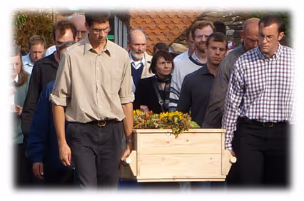 Many young men carry Siegfried's casket