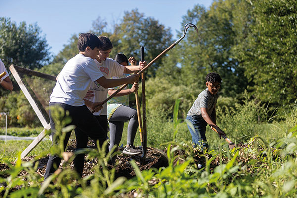Earthworks Youth Program students learn about different types of soil.