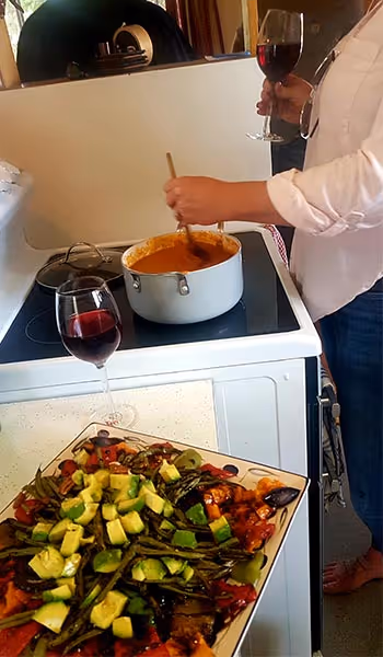a woman cooking at a stove