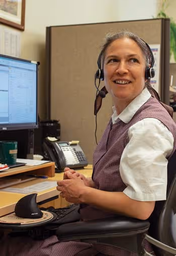A smiling customer service representative for Community Playthings