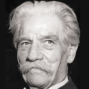 Portrait of an elderly man with white hair and mustache, looking slightly to the side.