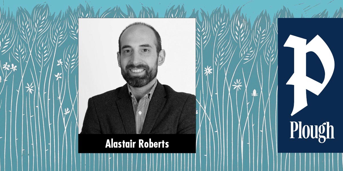 Black and white headshot of a smiling man in a suit and checkered shirt labeled Alastair Roberts.