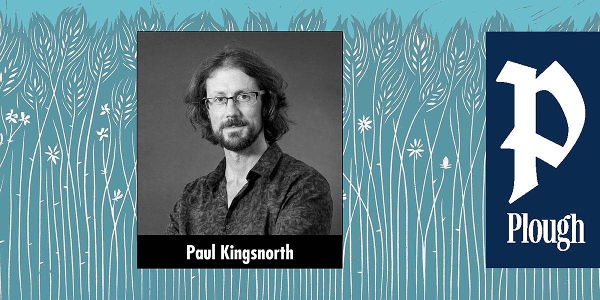 Black and white portrait of man with glasses and beard, labeled Paul Kingsnorth, on wheat field background.