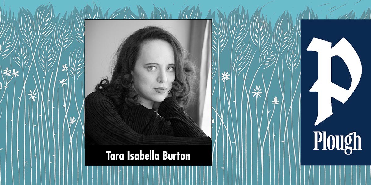 Black and white portrait of a woman with curly hair wearing a dark sweater, with a blue floral background.